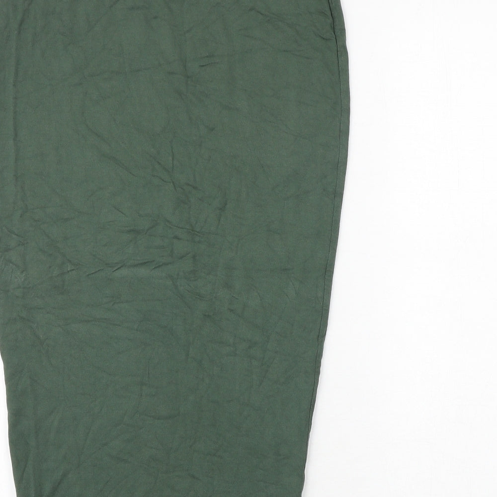 Brand and care label for Missguided women’s green viscose bandage skirt, size UK 10