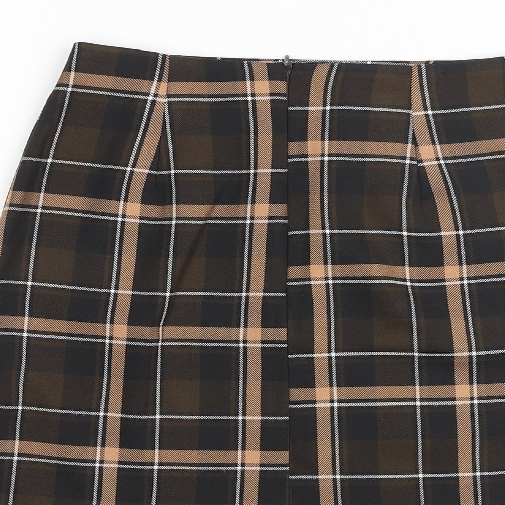 Brand and care label for Miss Selfridge women’s brown plaid polyester a-line skirt, size UK 4, zip