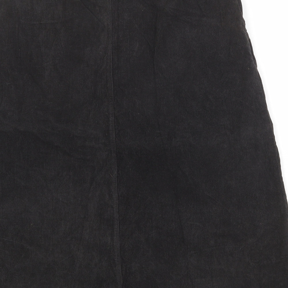 Brand and care label for C&A women’s brown cotton a-line skirt, size UK 18, button