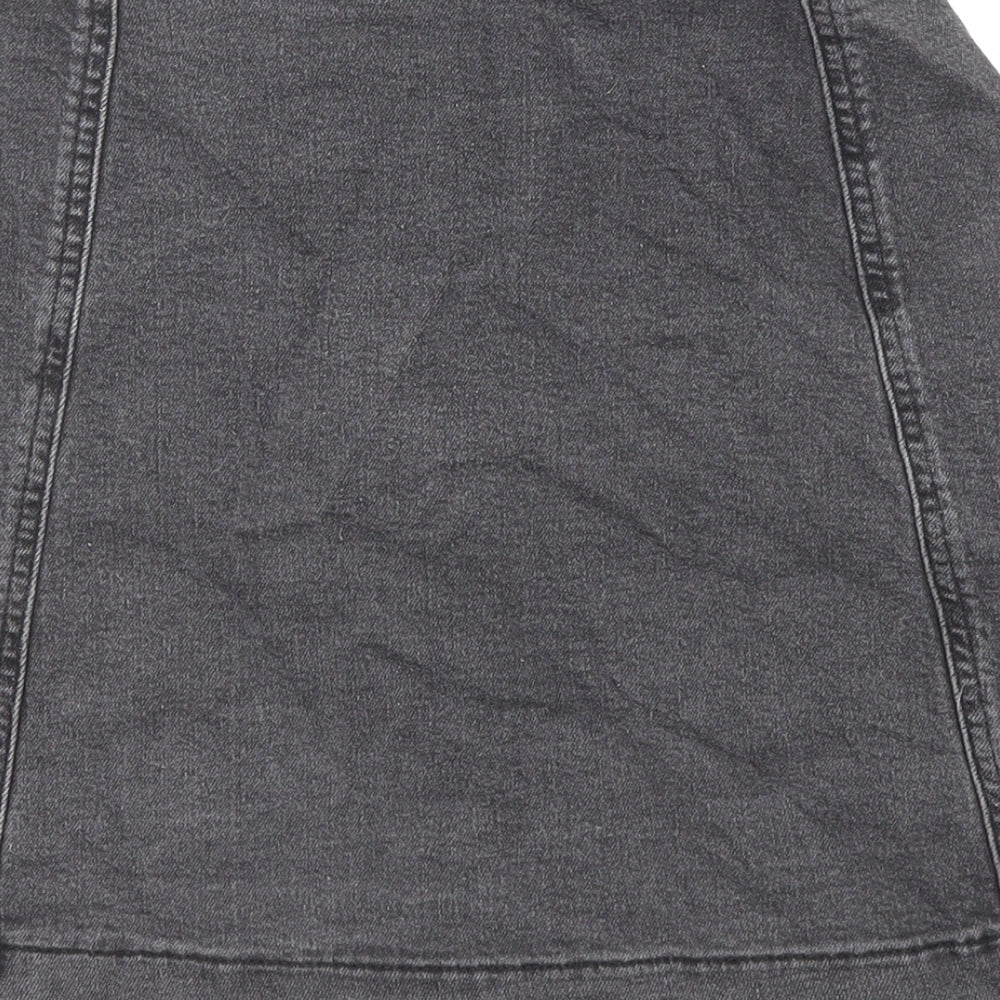 Brand and care label for Missguided women’s black cotton a-line skirt, size UK 8, button
