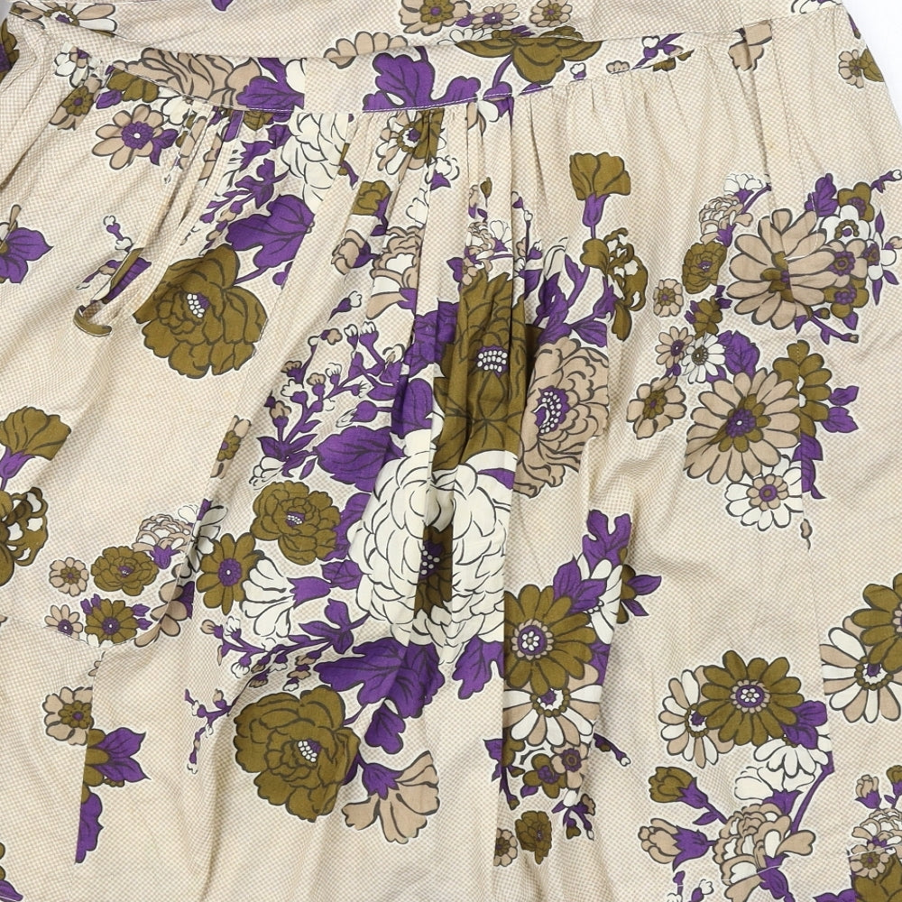 Brand and care label for French Connection women’s beige floral cotton swing skirt, size UK 6, zip