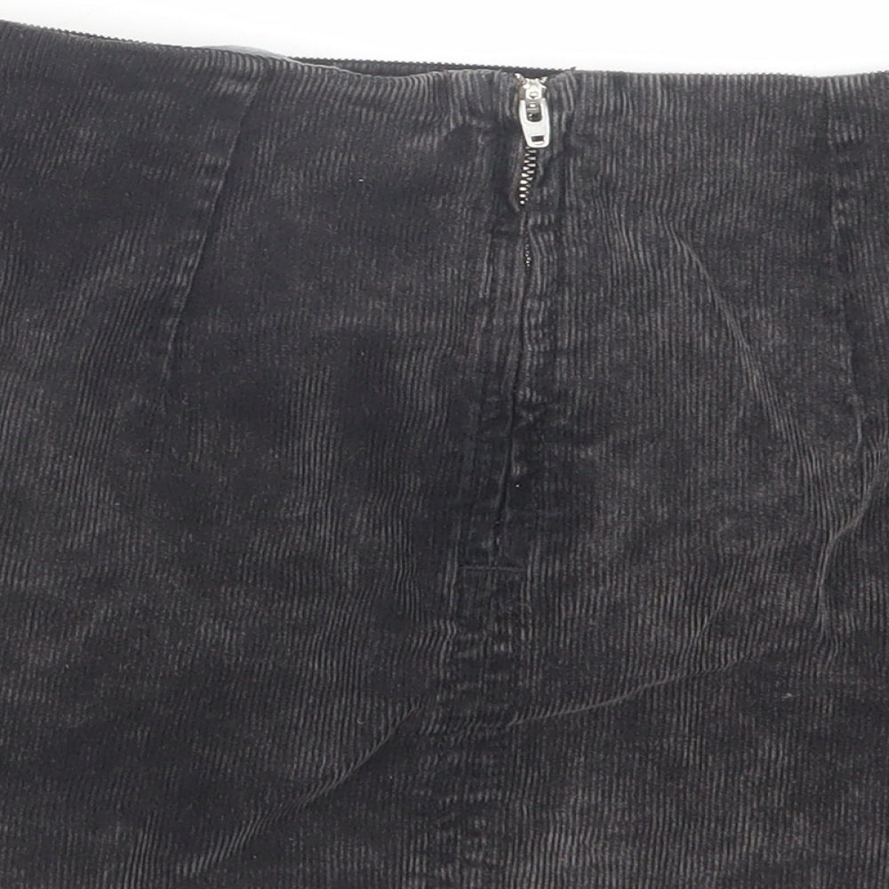 Brand and care label for BDG women’s grey cotton mini skirt, size XS, zip