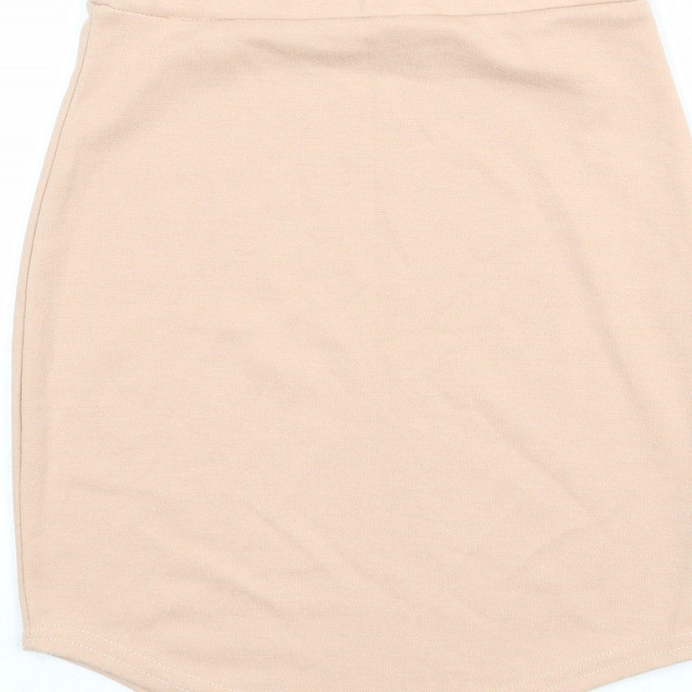 Brand and care label for Missguided women’s pink polyester bandage skirt, size UK 26, in