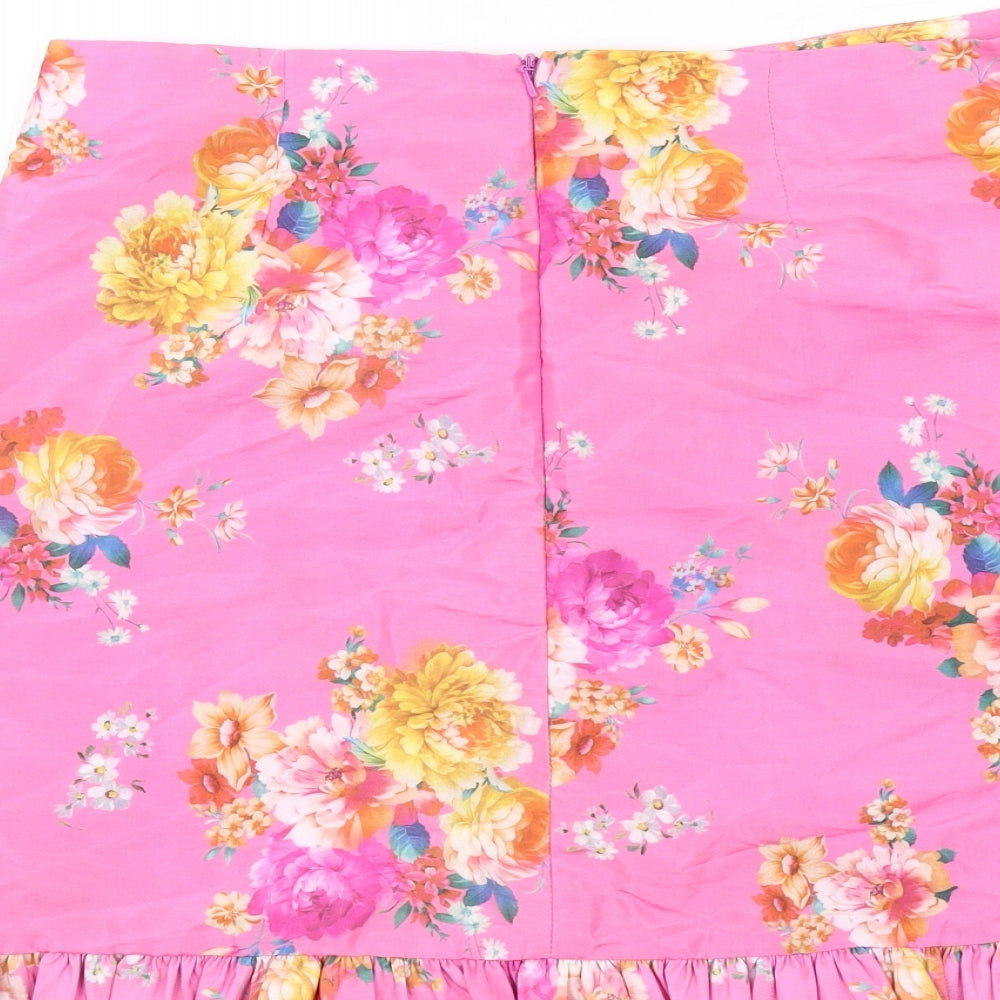 Brand and care label for ASOS women’s pink floral polyester trumpet skirt, size UK 10, zip