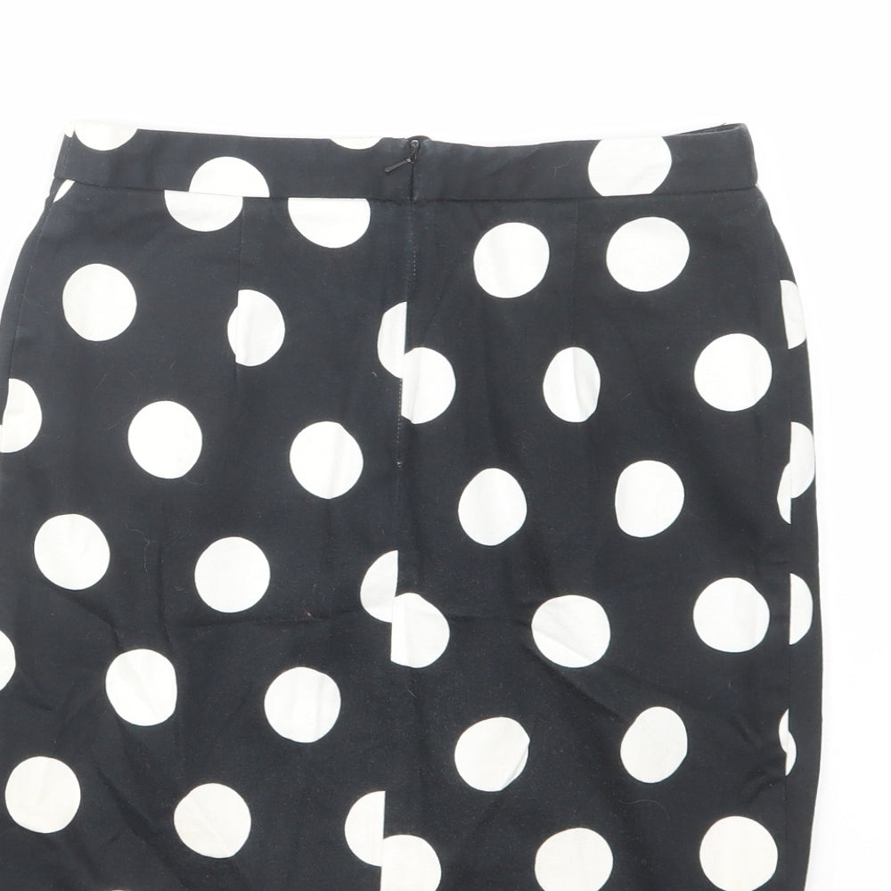 Brand and care label for ASOS women’s black polka dot cotton a-line skirt, size UK 8, zip