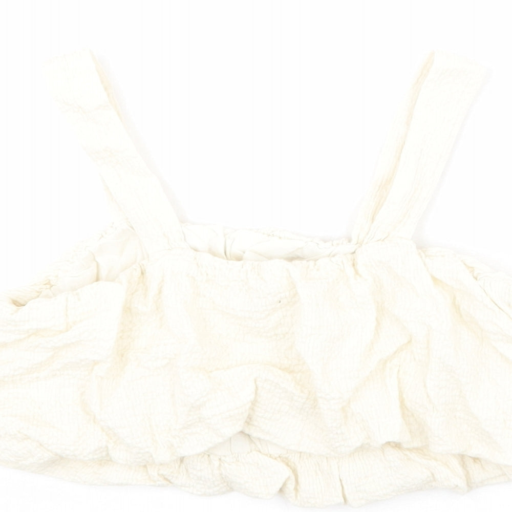 Brand and care label for Zara girls’ ivory polyester cropped blouse, size 10, years square neck pullover