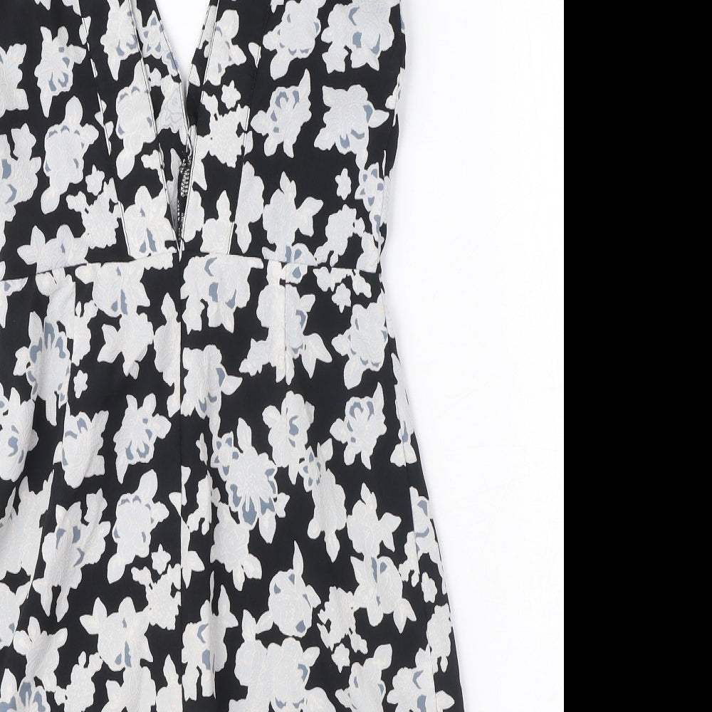 Brand and care label for Missguided women’s black floral polyester a-line, size UK 8, v-neck zip - cut out detail