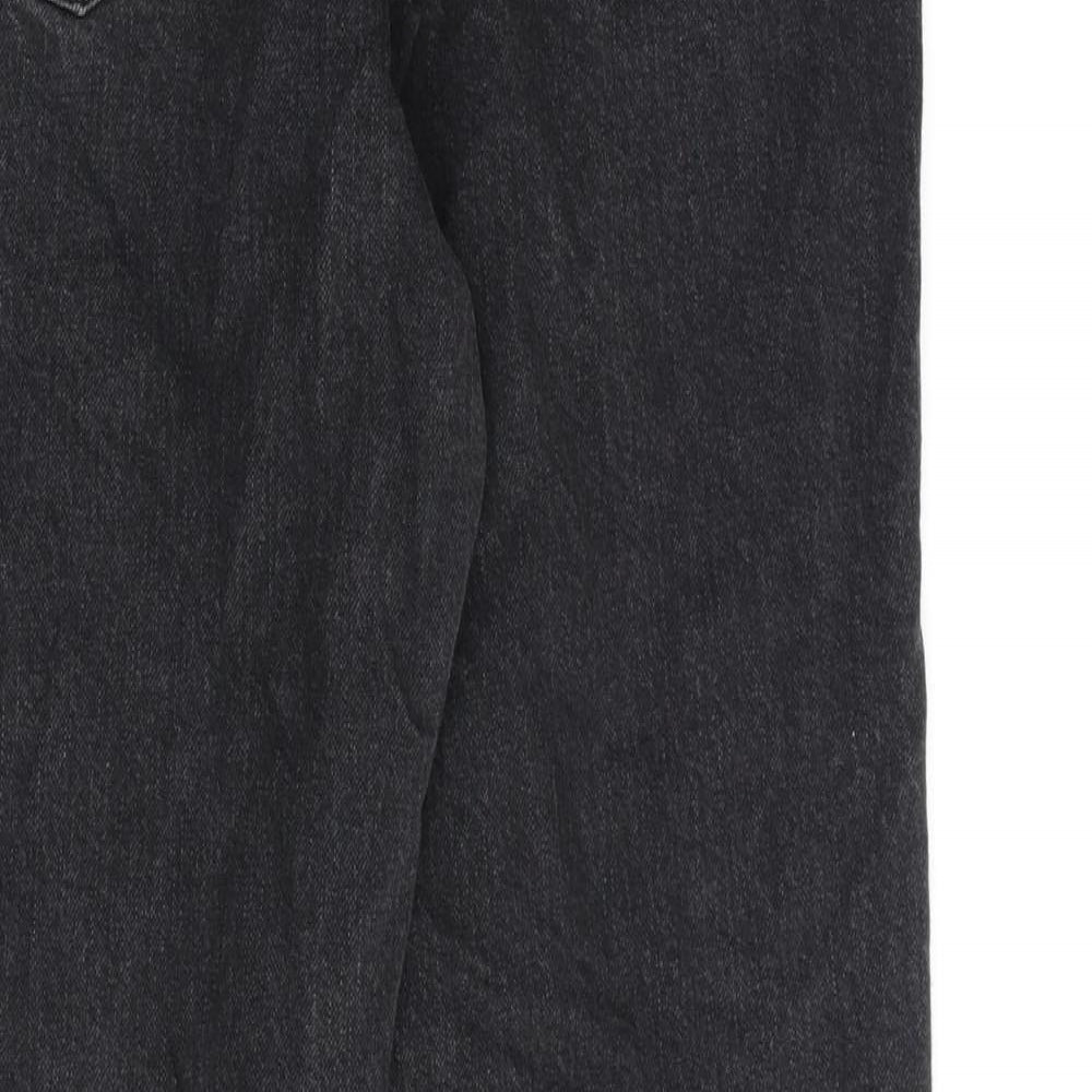 Brand and care label for ASOS women’s black cotton wide-leg jeans, size UK 30, in, 32-inch leg regular zip