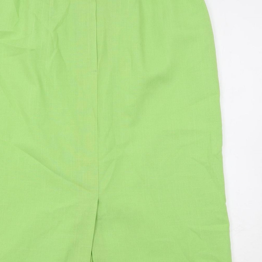 Brand and care label for C&A women’s green polyester a-line skirt, size UK 16, buckle