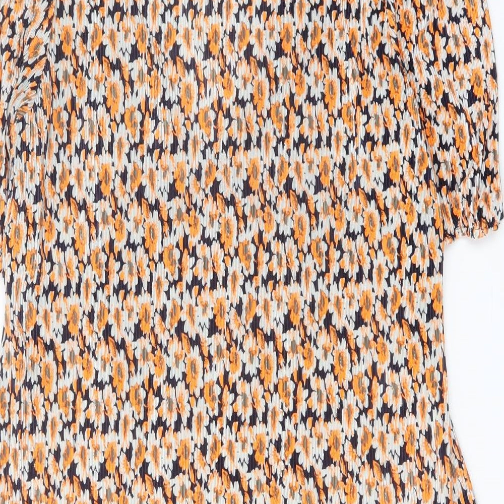Brand and care label for ASOS women’s orange floral polyester fit & flare, size UK 12, v-neck pullover
