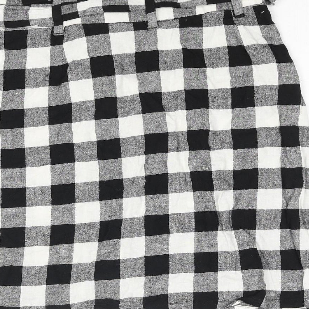 Brand and care label for ASOS women’s black check polyester a-line skirt, size UK 8, button - belted