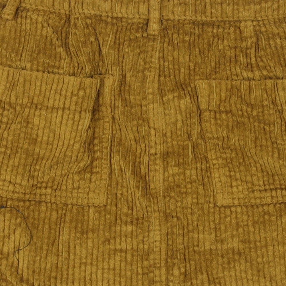 Brand and care label for BDG women’s yellow cotton a-line skirt, size S, zip