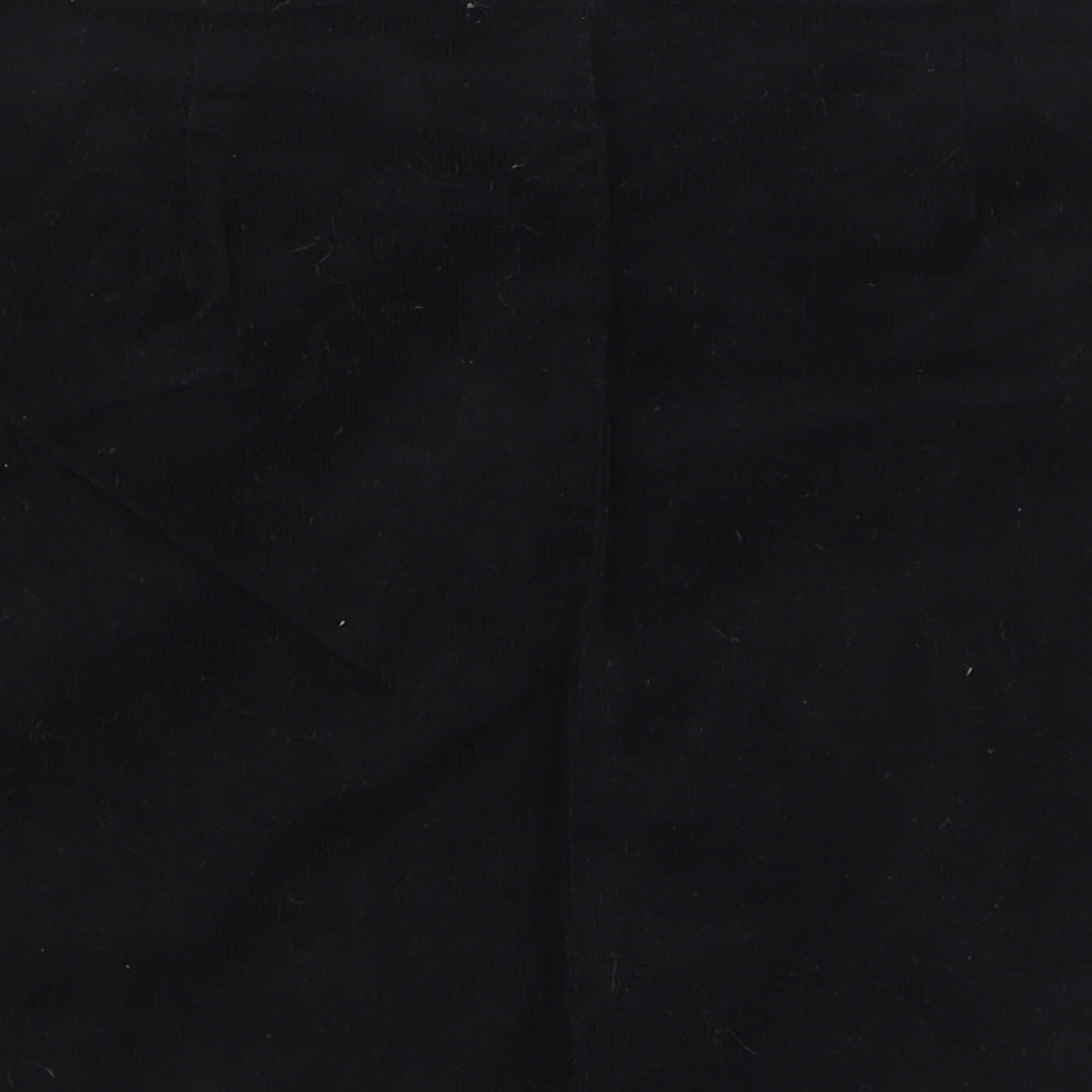 Brand and care label for ASOS women’s black cotton wrap skirt, size UK 10, button