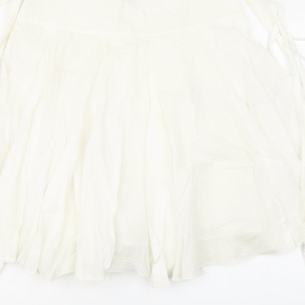 Brand and care label for Miss Selfridge women’s white cotton swing skirt, size UK 6, zip - tie detail