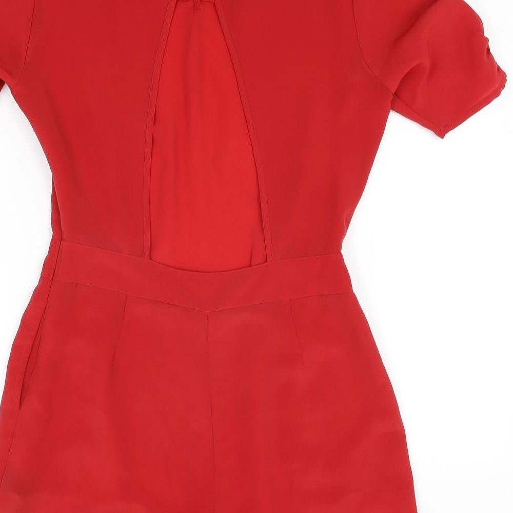 Brand and care label for ASOS women’s red polyester playsuit one-piece, size UK 10, 3-inch leg button - open back
