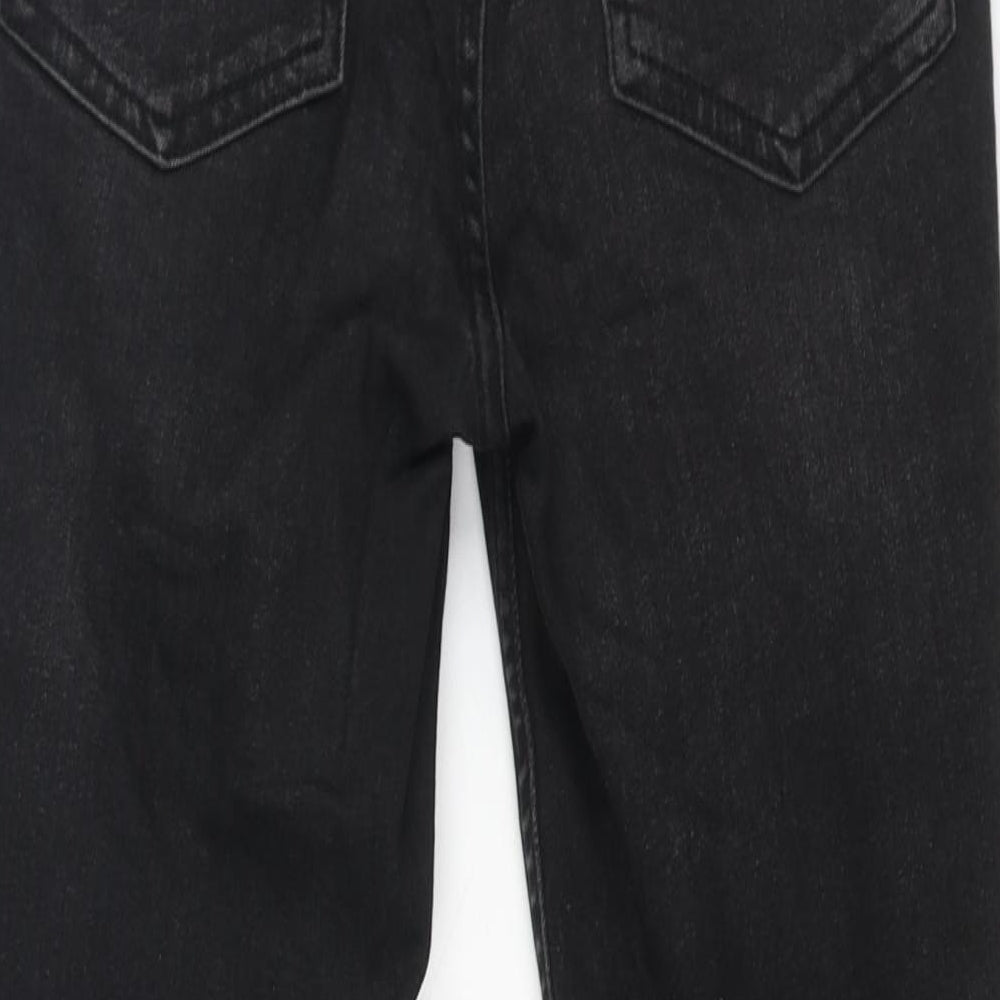 Brand and care label for BDG women’s black cotton skinny jeans, size UK 27, in, 30-inch leg regular zip