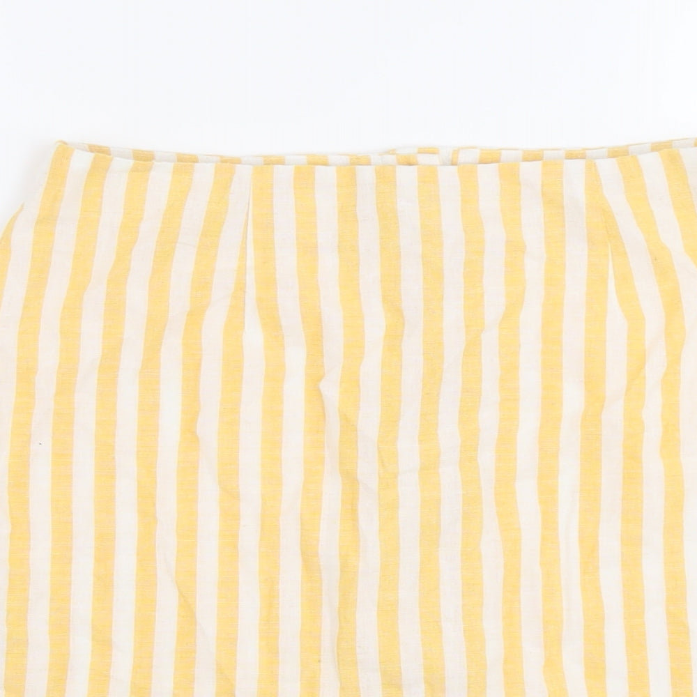 Brand and care label for Miss Selfridge women’s yellow striped polyester a-line skirt, size UK 12, button