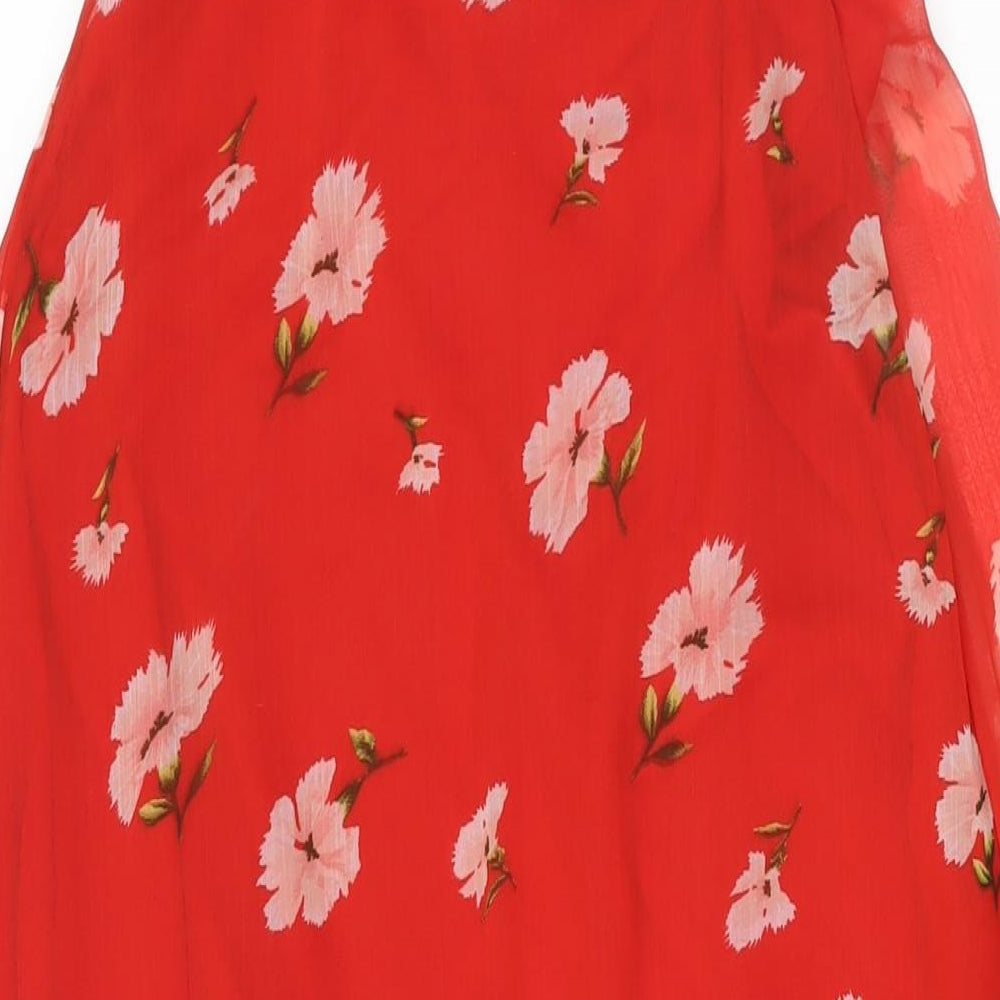 Brand and care label for Missguided women’s red floral polyester wrap dress, size UK 10, v-neck button - semi sheer frill