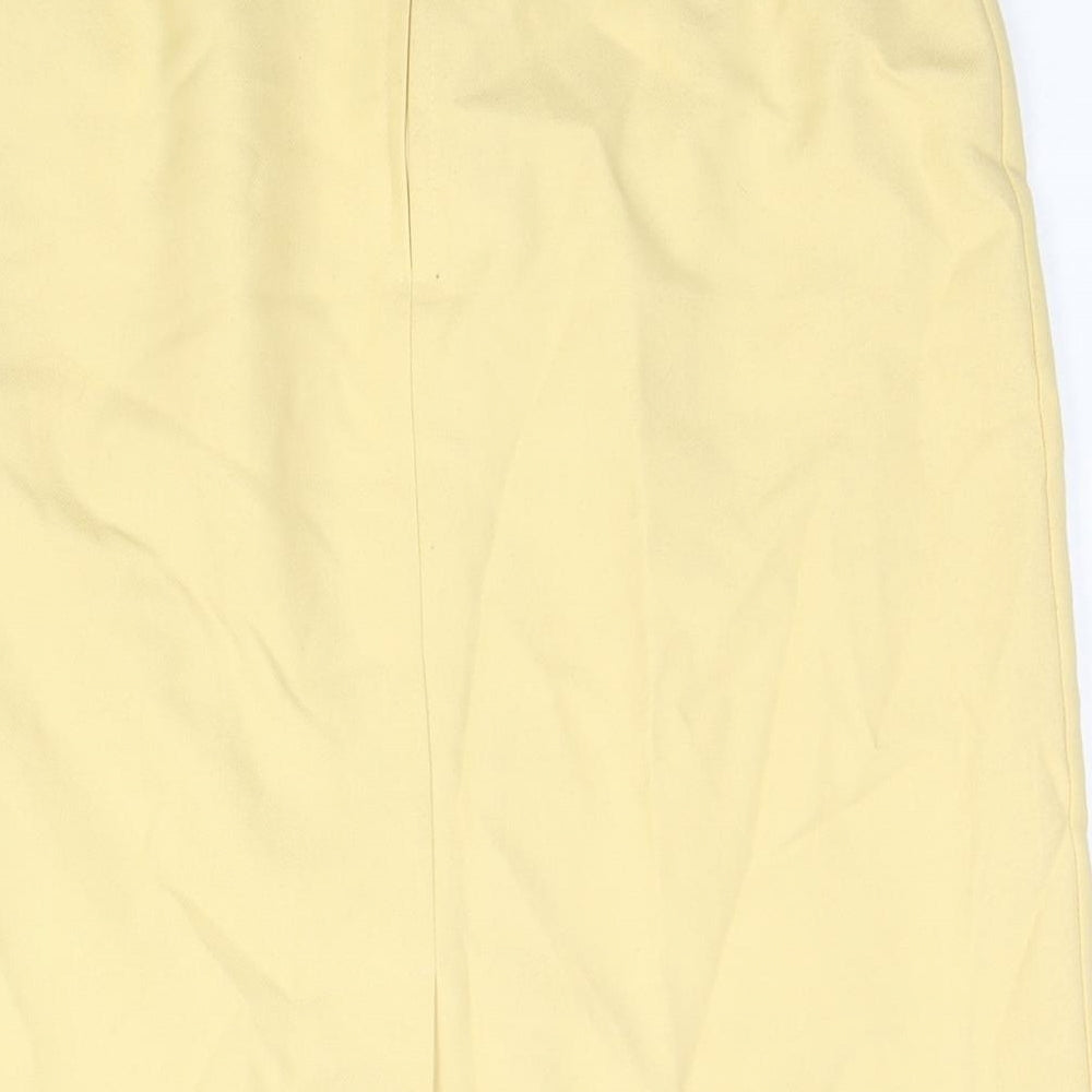 Brand and care label for C&A women’s yellow polyester straight & pencil skirt, size UK 12, zip - belted button detail