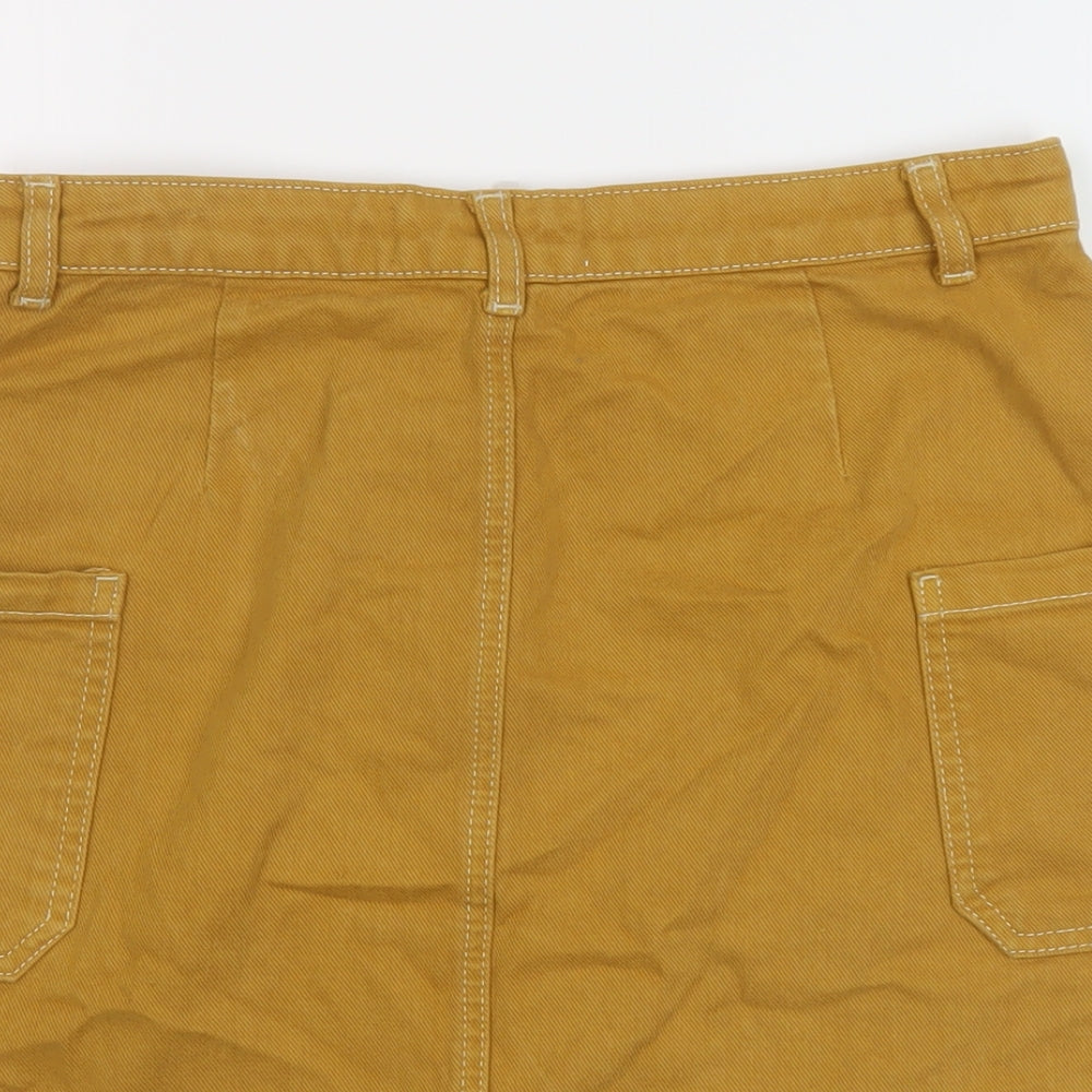 Brand and care label for BDG women’s brown cotton mini skirt, size M, button