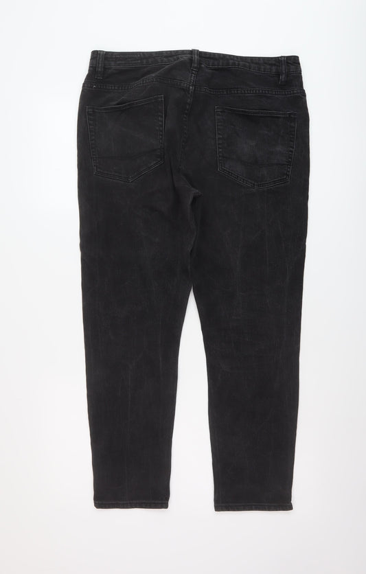 Back view of ASOS women’s black cotton tapered jeans, size UK 34, in, 27-inch leg regular button