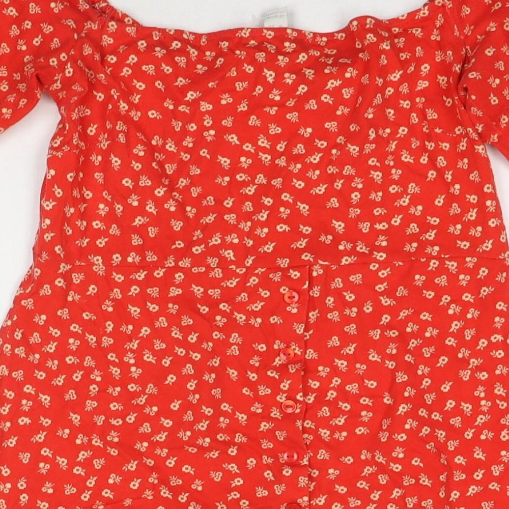 Brand and care label for ASOS women’s red floral polyester blend t-shirt dress, size UK 6, off the shoulder button