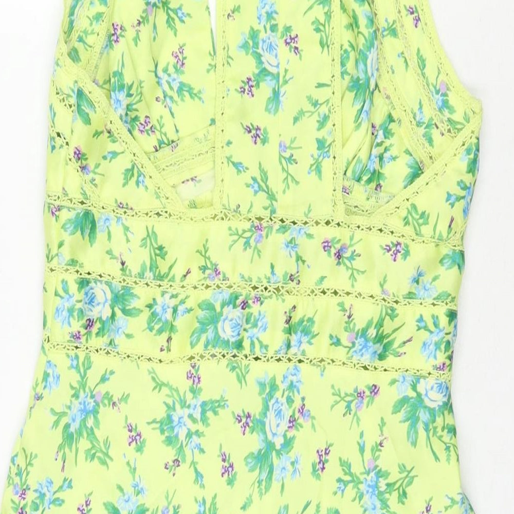 Brand and care label for ASOS women’s green floral polyester tank dress, size UK 6, v-neck button