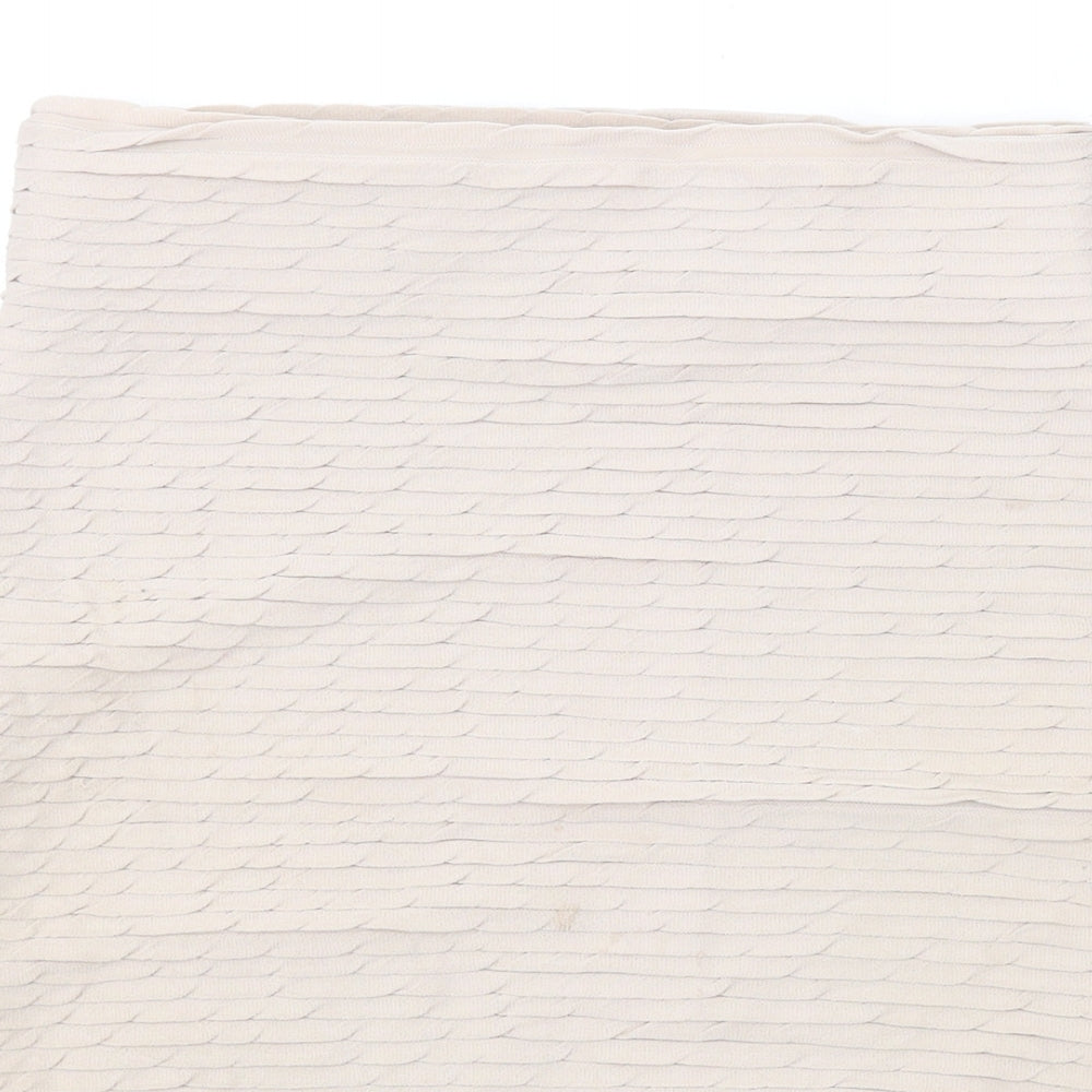 Brand and care label for Miss Selfridge women’s beige polyester bandage skirt, size UK 8