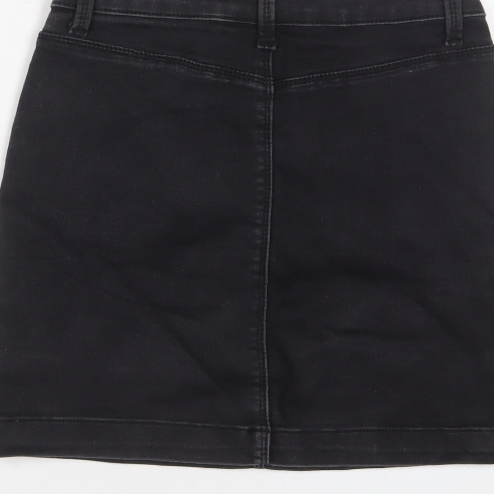Brand and care label for Missguided women’s black cotton a-line skirt, size UK 8, zip