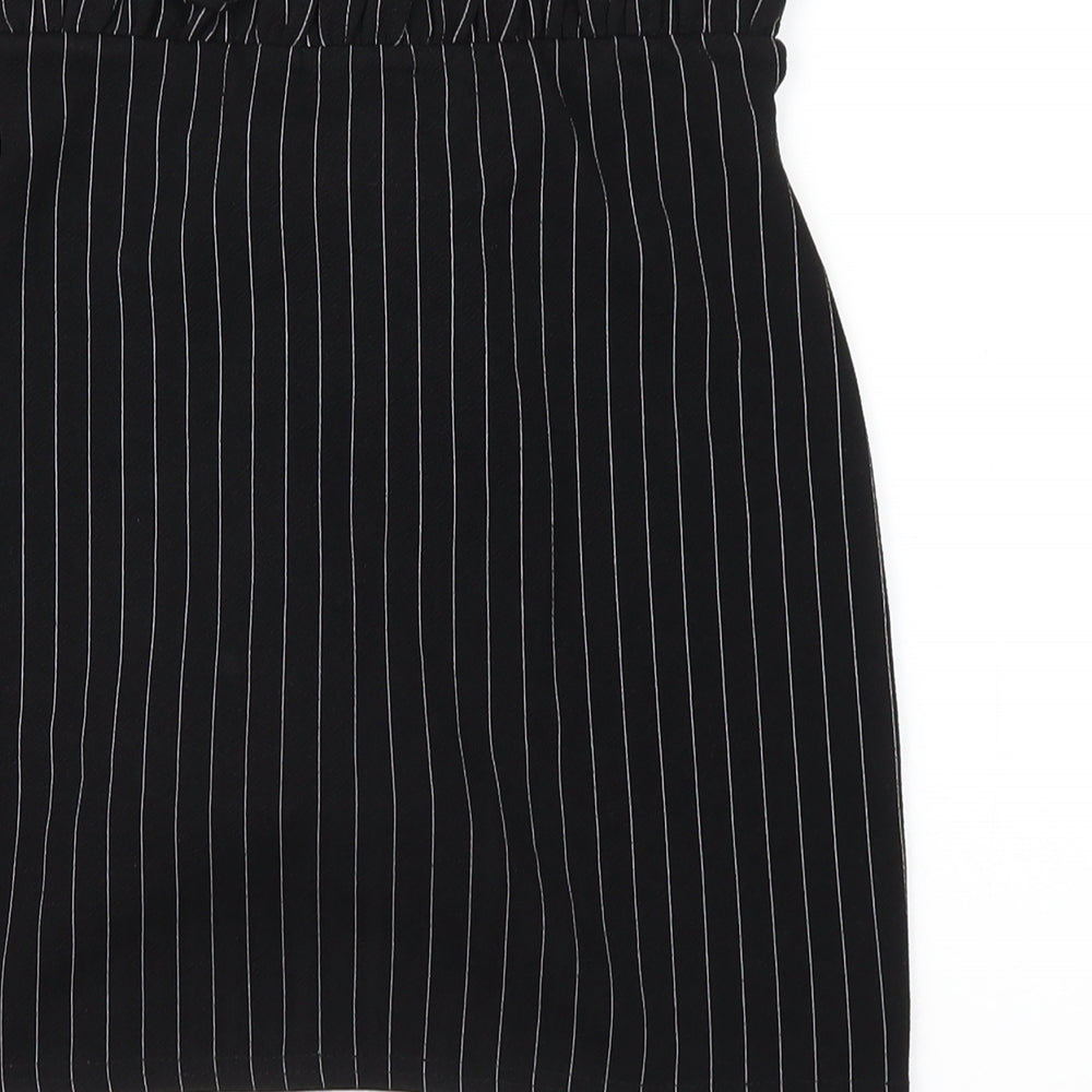 Brand and care label for I SAW IT FIRST women’s black striped polyester mini skirt, size UK 8