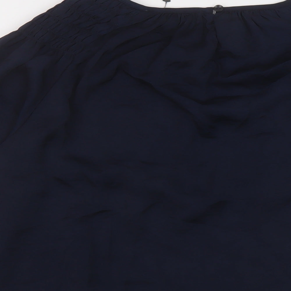 Brand and care label for Alex & Lili women’s blue polyester basic blouse, size M, round neck