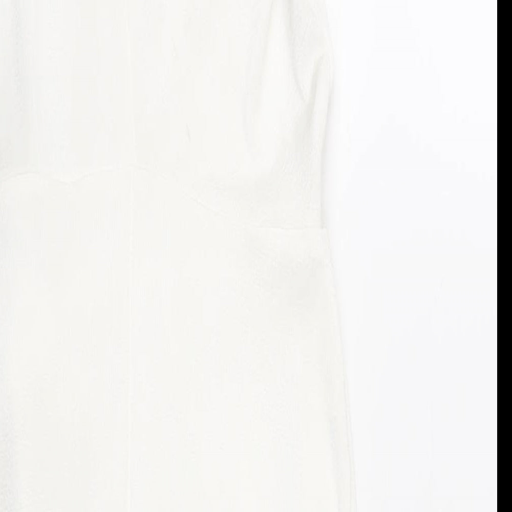 Brand and care label for ASOS women’s white polyester bodycon, size UK 10, mock neck button
