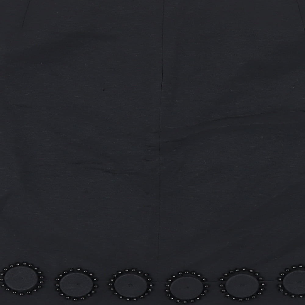 Brand and care label for Autograph women’s black cotton a-line skirt, size UK 10, zip