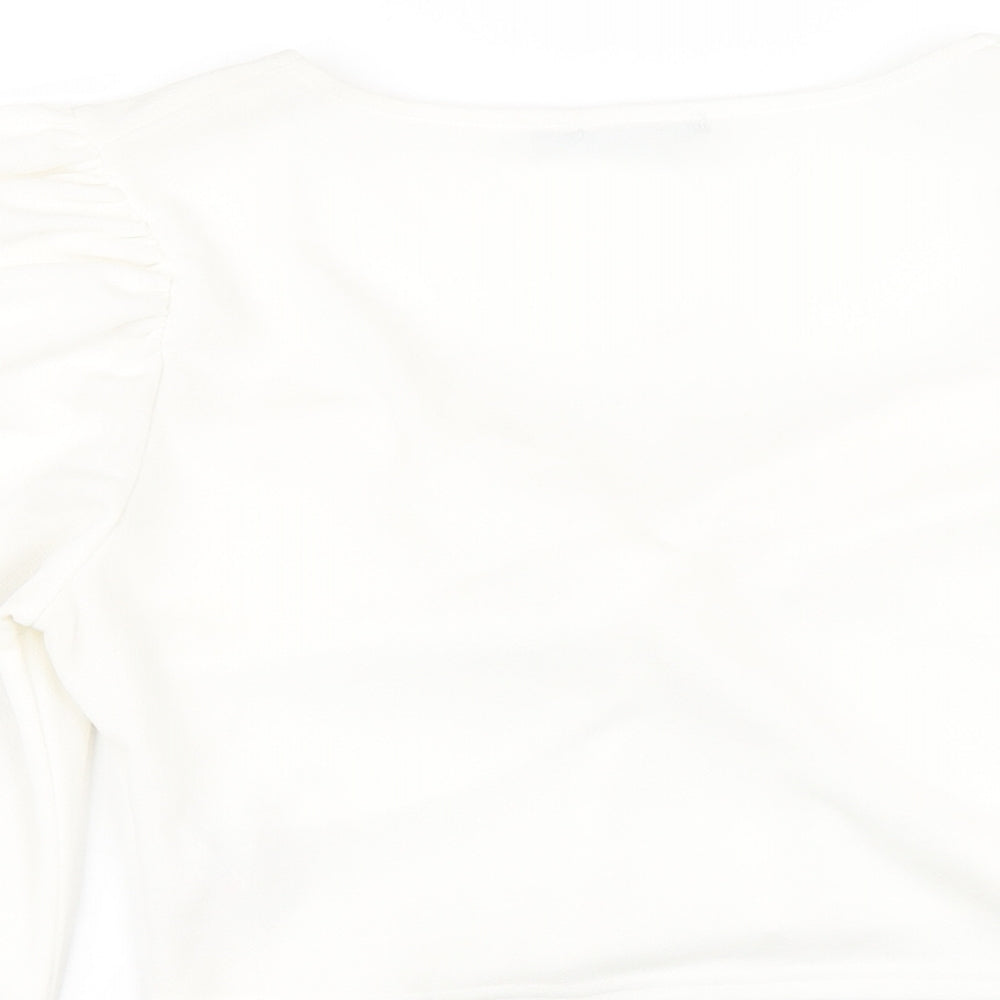 Brand and care label for I SAW IT FIRST women’s white polyester cropped t-shirt, size UK 16, v-neck