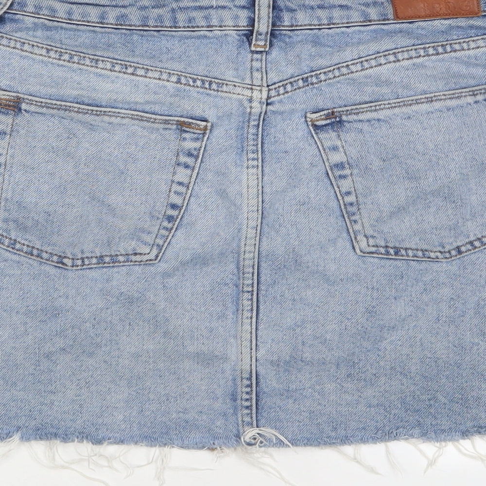 Brand and care label for BDG women’s blue cotton a-line skirt, size S, zip