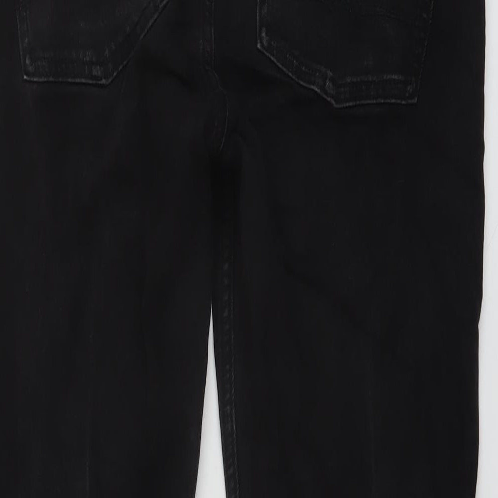 Brand and care label for ASOS men’s black cotton skinny jeans, size 31, in, 32-inch leg regular button
