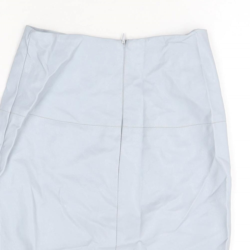Brand and care label for Missguided women’s blue polyurethane mini skirt, size UK 6, zip