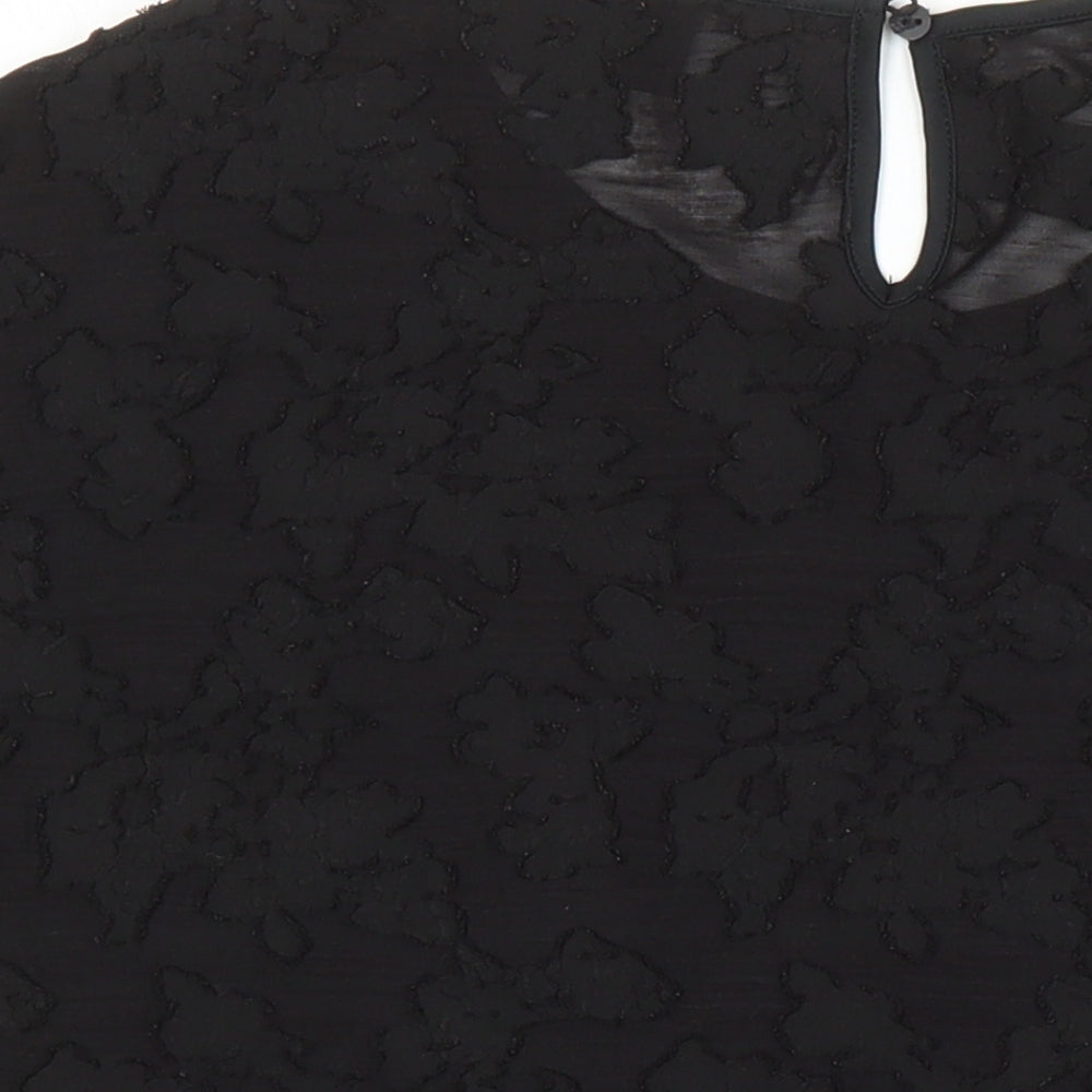 Brand and care label for ESPRIT women’s black polyester tunic blouse, size L, round neck