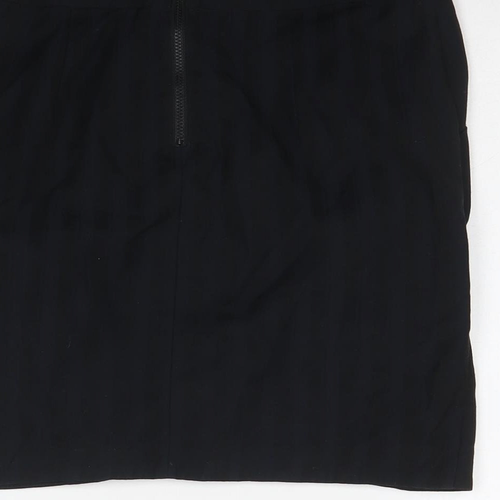 Brand and care label for Miss Selfridge women’s black polyester a-line skirt, size UK 10, zip