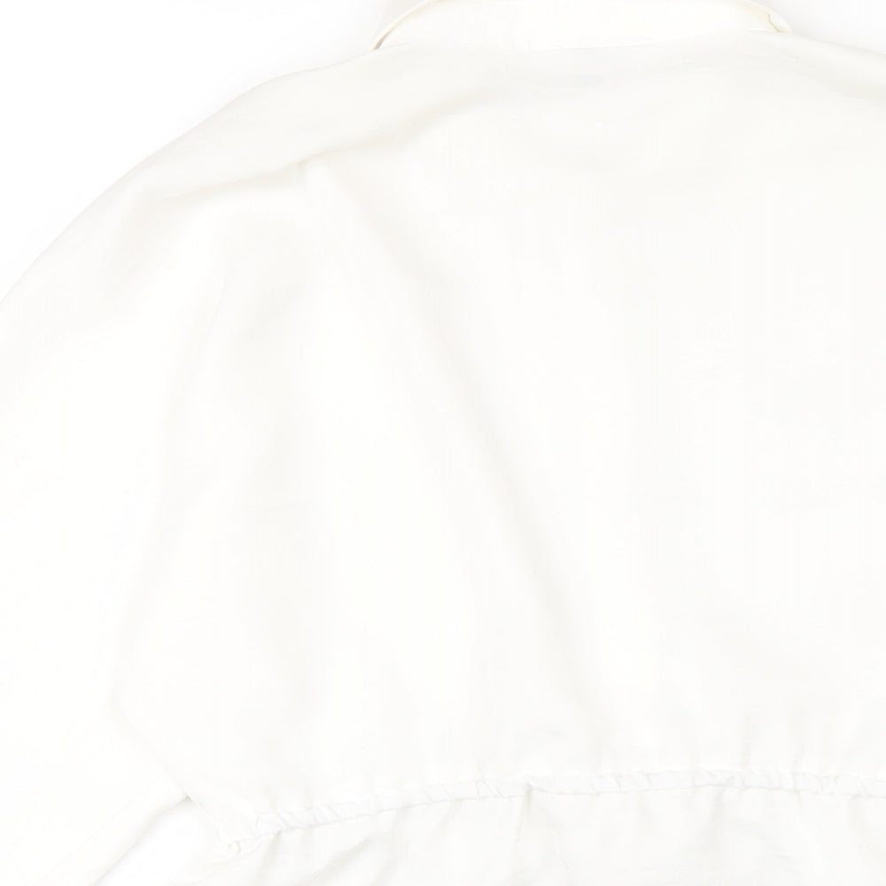Brand and care label for River Island girls’ white polyester basic button-up, size 11-12, years collared button