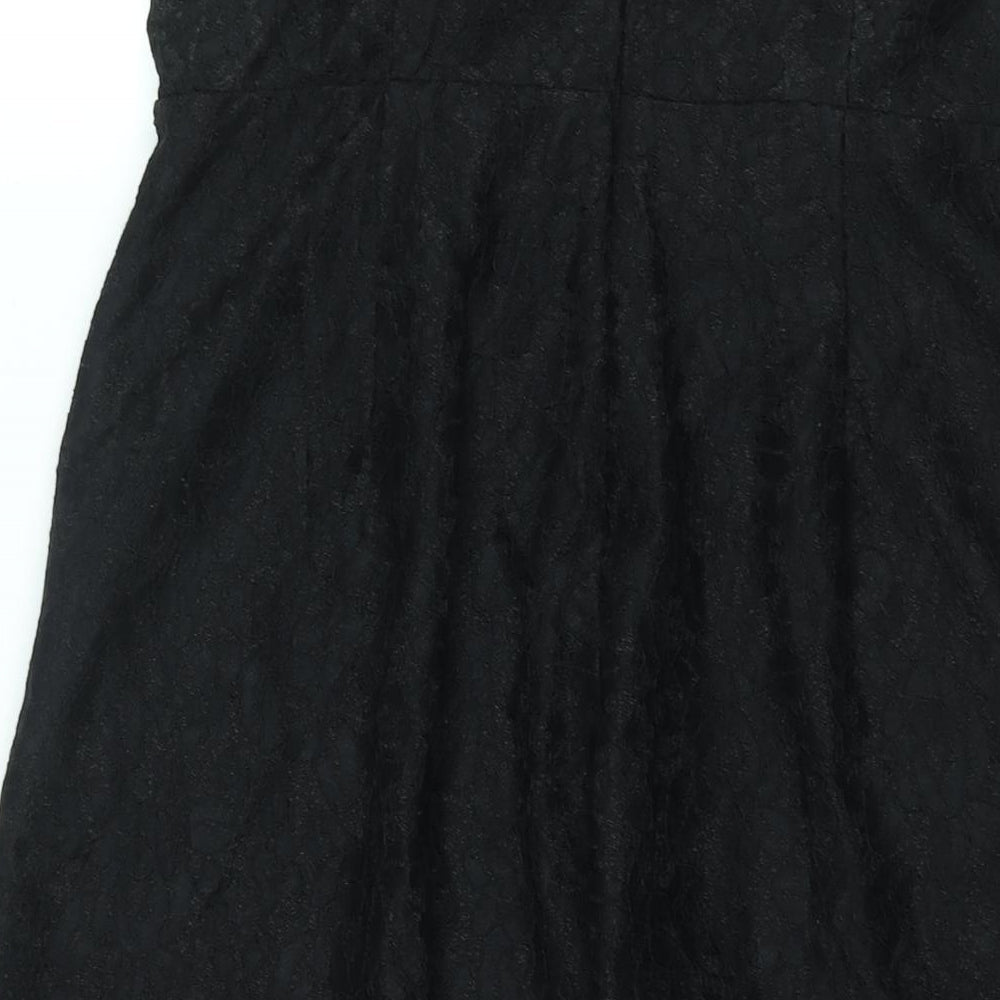 Brand and care label for Missguidd women’s black polyester jumpsuit one-piece, size UK 12, 16-inch leg zip