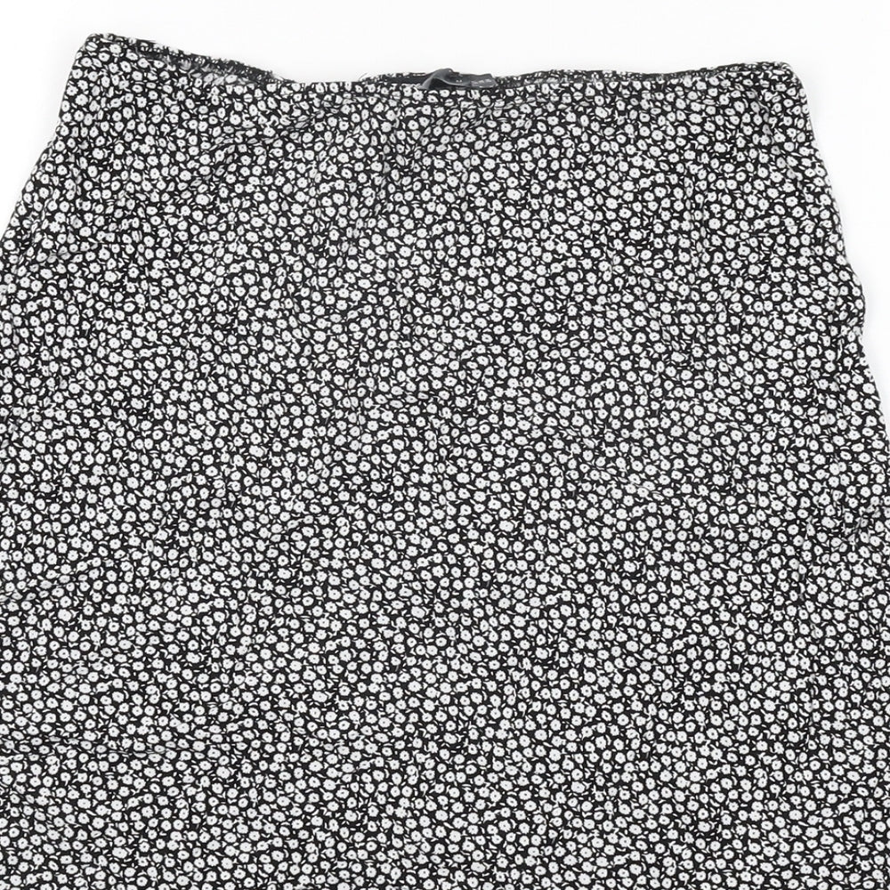 Brand and care label for ASOS women’s black floral viscose mini skirt, size UK 8