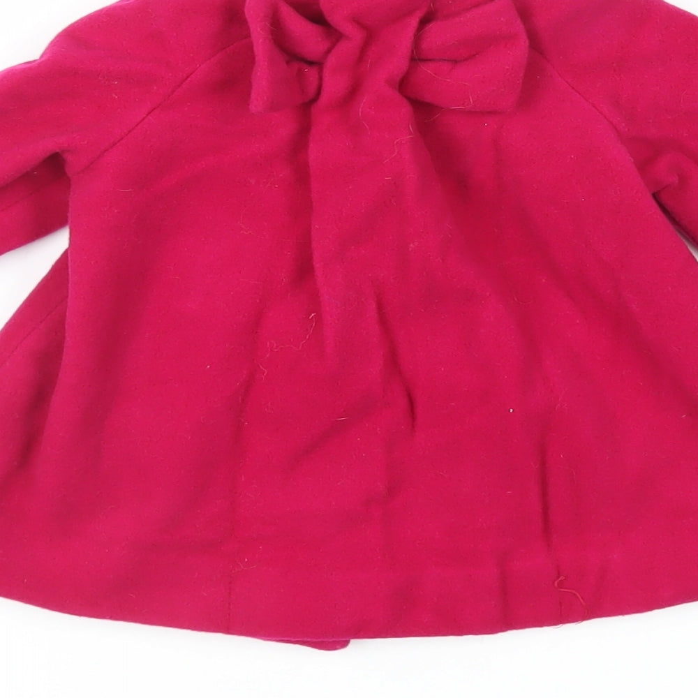 Brand and care label for Zara girls’ pink basic coat coat, size 9-12, months button