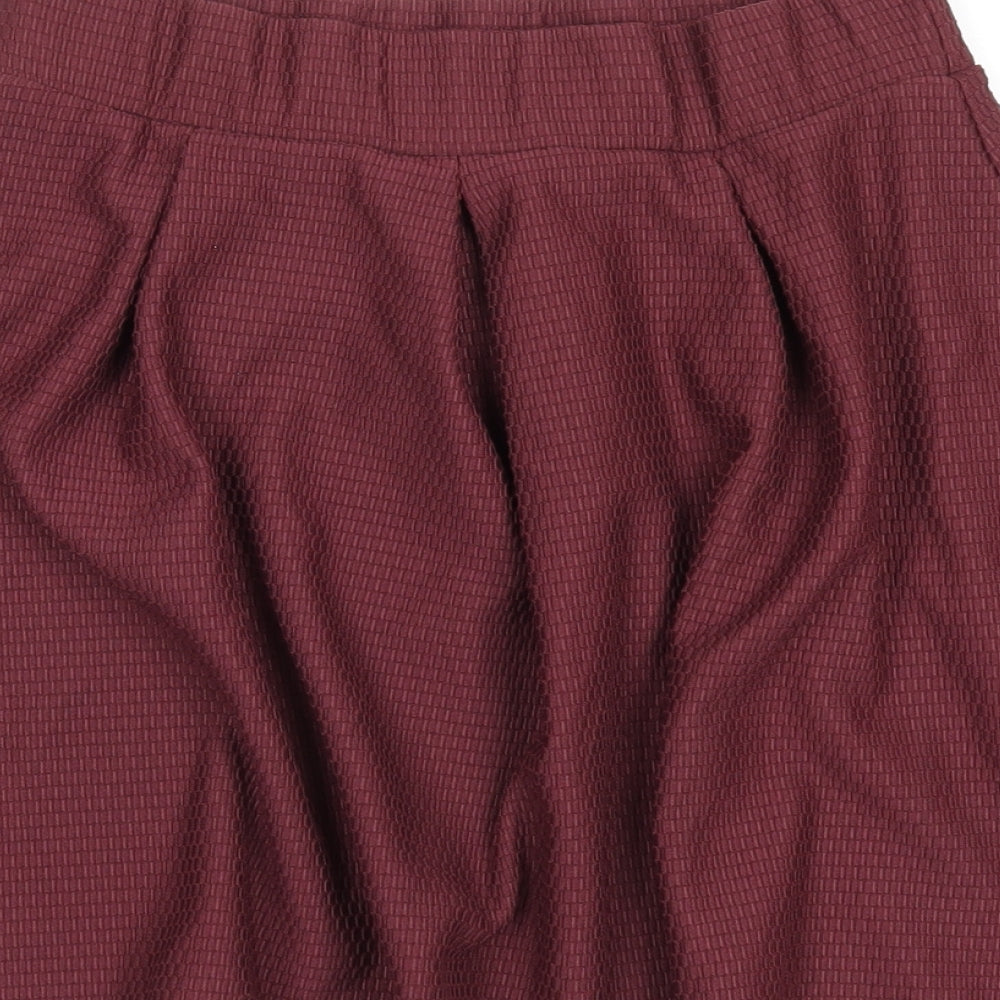 Brand and care label for ASOS women’s purple polyester skater skirt, size UK 10
