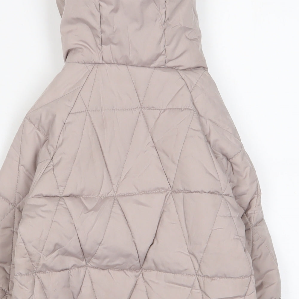 Brand and care label for Gap girls’ pink quilted coat, size 3, years zip
