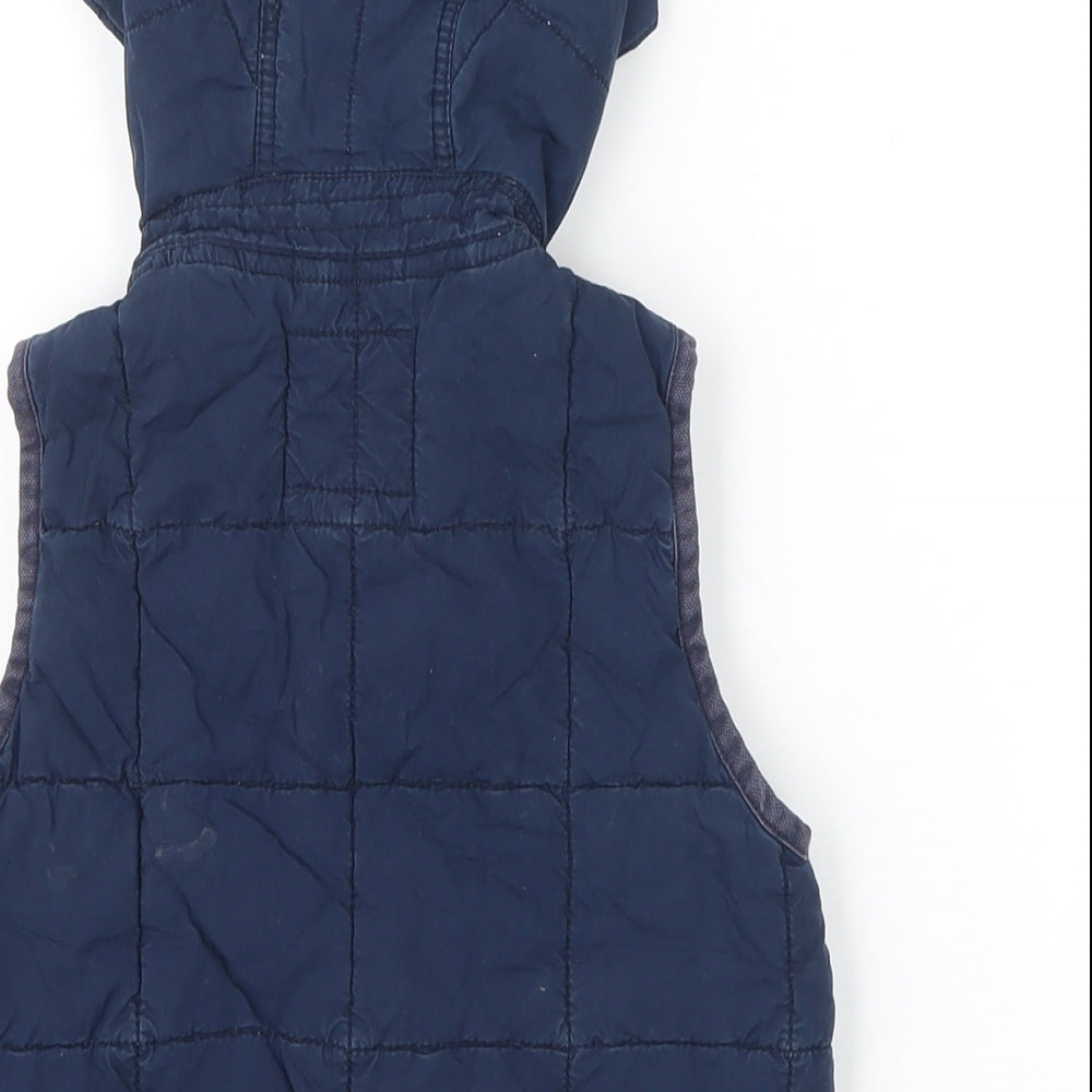 Brand and care label for Gap boys’ blue gilet waistcoat, size 2, years button