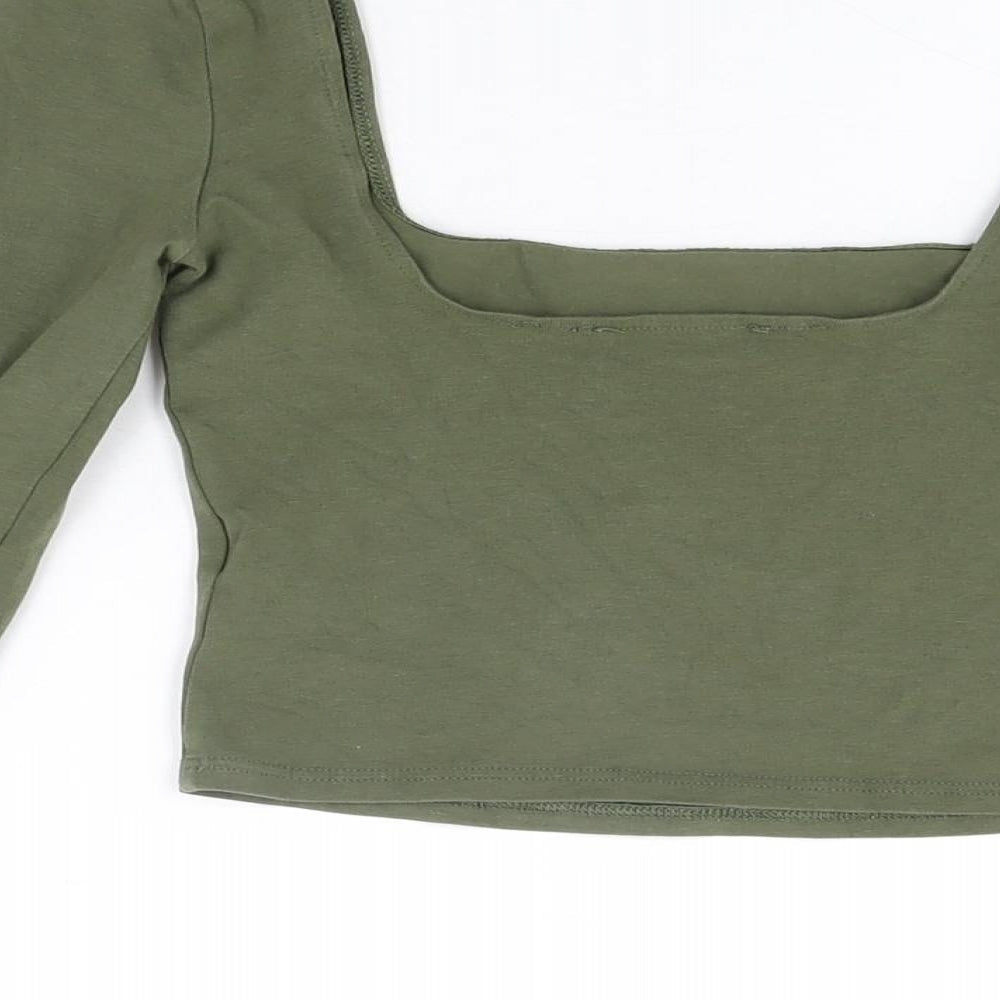 Brand and care label for Miss Selfridge women’s green cotton cropped t-shirt, size UK 8, square neck