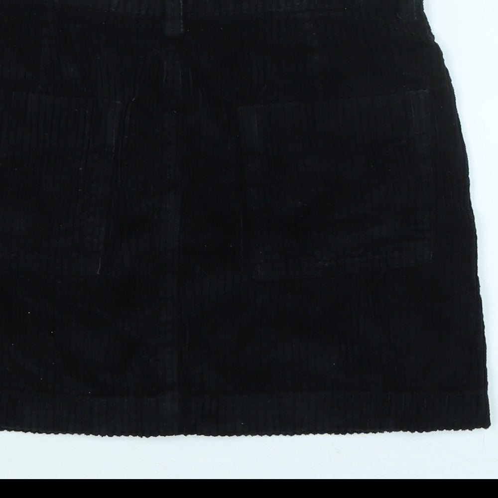 Brand and care label for BDG women’s black cotton blend a-line skirt, size XS, zip