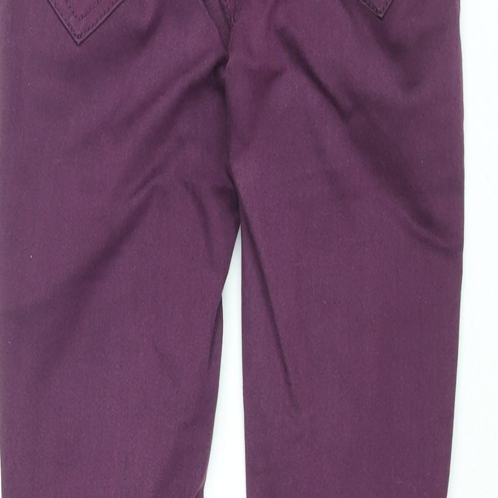 Brand and care label for Miss Selfridge women’s purple cotton skinny jeans, size UK 8, 31-inch leg regular zip