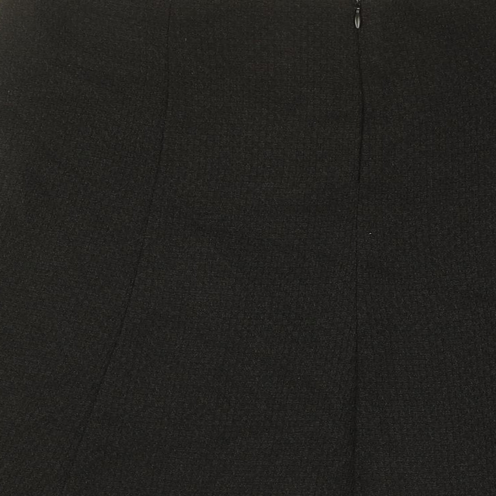 Brand and care label for AMARANTO women’s black polyester swing skirt, size UK 14, zip